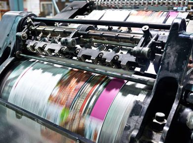 Detail shot of the workings of a printing factory. The commercial designs displayed in this image represent a simulation of a real product and have been changed or altered enough by our team of retouching and design specialists so that they are free of any copyright infringements